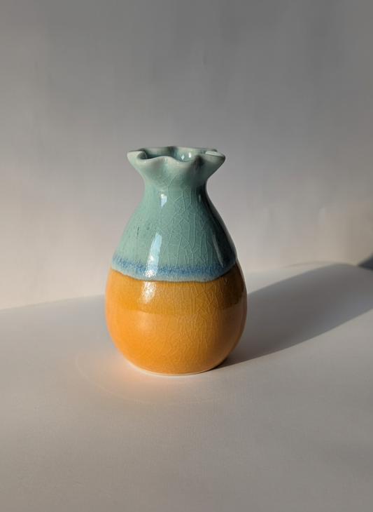 Two-Tone Orange Glazed Mini Ceramic Vase on White Background with Sunlight